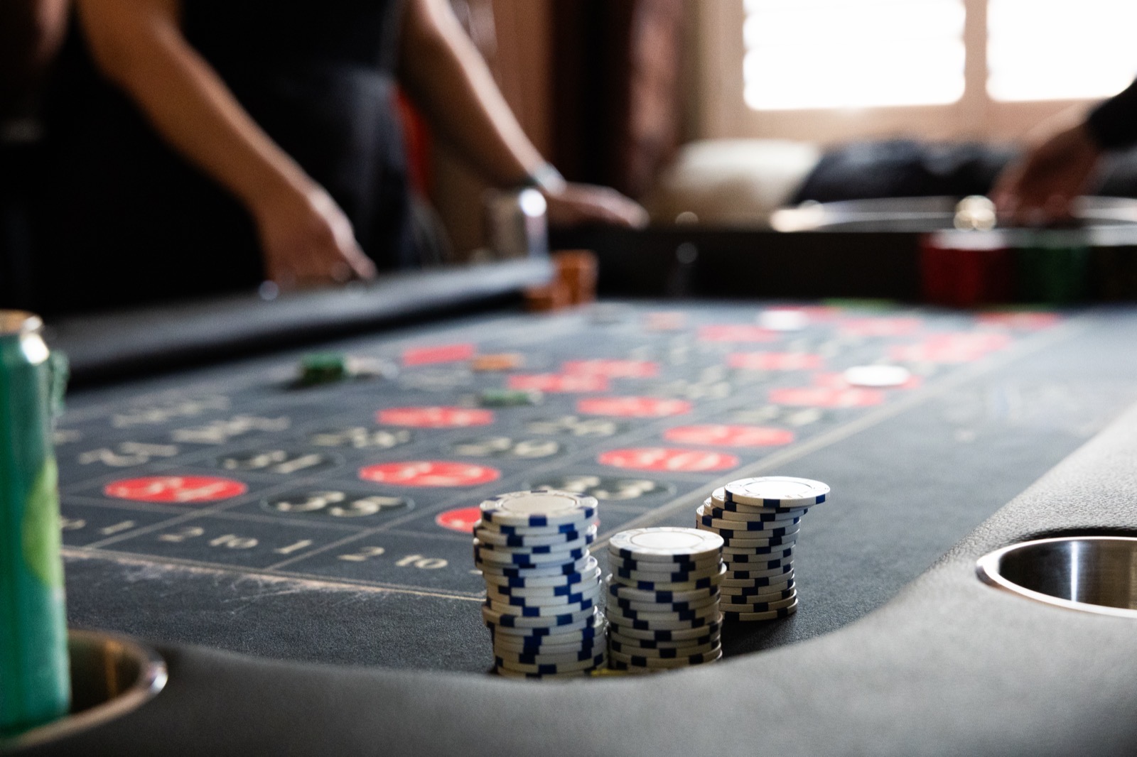 Casino chips stacked on a Spark roulette table